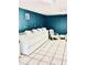 Laundry room offers multiple machines, seating and tiled floor at 200 Country Club Dr # 407, Largo, FL 33771