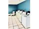 Well-maintained community laundry room with modern machines and a relaxing atmosphere at 200 Country Club Dr # 407, Largo, FL 33771