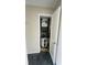 Small utility closet featuring a water heater and plumbing at 200 Country Club Dr # 407, Largo, FL 33771