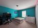 Vibrant bedroom featuring bright walls, natural light, and a carpeted floor at 20314 Starfinder Way, Tampa, FL 33647