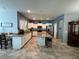 Modern kitchen with white cabinetry, granite countertops, stainless steel appliances, and a breakfast bar at 20314 Starfinder Way, Tampa, FL 33647