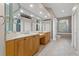 Bathroom features double sinks, tile floors, bathtub, and ample cabinet space at 3830 Moreno Dr, Palm Harbor, FL 34685