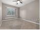 Bright bedroom features neutral paint, a ceiling fan, and a window seat beneath the window at 3830 Moreno Dr, Palm Harbor, FL 34685
