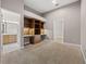 Bedroom features built-in shelving, desk space, and neutral carpet at 3830 Moreno Dr, Palm Harbor, FL 34685