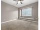 Empty bedroom offers a ceiling fan and large window seat with natural light at 3830 Moreno Dr, Palm Harbor, FL 34685