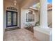 Elegant home entrance features a double door, decorative window and welcome mat at 3830 Moreno Dr, Palm Harbor, FL 34685