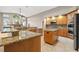 Well-equipped kitchen with granite countertops, stainless steel appliances, and tile flooring at 3830 Moreno Dr, Palm Harbor, FL 34685