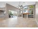 Open-concept living room with tile floors, a vaulted ceiling, and a view of the pool and lanai at 3830 Moreno Dr, Palm Harbor, FL 34685