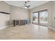 Open living area with tile floors, ceiling fan, and custom cabinets with a wine cooler at 3830 Moreno Dr, Palm Harbor, FL 34685