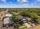 Aerial view showcasing a modern two-story home with a balcony and attached garage in a neighborhood setting at 4406 W Euclid Ave, Tampa, FL 33629