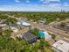 Panoramic aerial view of a modern home surrounded by lush trees, showcasing its location in a vibrant area at 4406 W Euclid Ave, Tampa, FL 33629