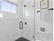 Modern bathroom boasts a glass shower with marble tile and sleek black fixtures at 4406 W Euclid Ave, Tampa, FL 33629