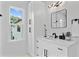 Bathroom with a sleek vanity, modern lighting, and ample cabinet space at 4406 W Euclid Ave, Tampa, FL 33629