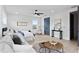 Spacious bedroom with hardwood floors, a ceiling fan, and natural light from a large window at 4406 W Euclid Ave, Tampa, FL 33629