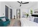 Stylish bedroom featuring a comfortable seating area and ample natural light at 4406 W Euclid Ave, Tampa, FL 33629