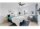 Comfortable bedroom with a ceiling fan, a side chair, and an accent rug at 4406 W Euclid Ave, Tampa, FL 33629
