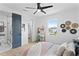 Bedroom with a desk, natural light, decorative wall hangings, and a view to the en suite bathroom at 4406 W Euclid Ave, Tampa, FL 33629