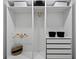 Spacious closet featuring multiple shelves and hanging rods for storage solutions at 4406 W Euclid Ave, Tampa, FL 33629