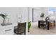 Bright dining area features modern table, chairs, and artwork, perfect for entertaining at 4406 W Euclid Ave, Tampa, FL 33629