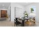 Bright dining area with a dark wood table, artful decor, and a view to the exterior at 4406 W Euclid Ave, Tampa, FL 33629