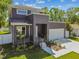 Charming two-story home with modern architectural details and a beautifully landscaped front yard at 4406 W Euclid Ave, Tampa, FL 33629