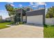 Stylish two-story home featuring a clean facade, a two-car garage, and a well-manicured lawn at 4406 W Euclid Ave, Tampa, FL 33629