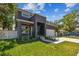 Modern two-story home with a charming front porch and professional landscaping at 4406 W Euclid Ave, Tampa, FL 33629