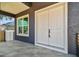 Inviting front entrance with double doors, tile floor and a sleek, modern design at 4406 W Euclid Ave, Tampa, FL 33629