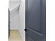 Clean hallway with grey doors and light-colored flooring; modern and stylish design at 4406 W Euclid Ave, Tampa, FL 33629