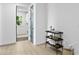 Hallway area with a console table and storage; adjacent is a laundry area at 4406 W Euclid Ave, Tampa, FL 33629