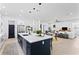 Spacious open-concept kitchen island with modern appliances and seamless flow to living spaces at 4406 W Euclid Ave, Tampa, FL 33629
