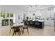 Open kitchen and dining area with large island and sliding glass doors to the patio at 4406 W Euclid Ave, Tampa, FL 33629