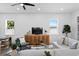 Bright living room with a wooden media center and view from the many windows at 4406 W Euclid Ave, Tampa, FL 33629