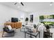 Comfortable living room with a sectional sofa and a view to the backyard patio at 4406 W Euclid Ave, Tampa, FL 33629