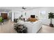 Spacious living room with white sofas, a decorative ceiling fan, and plenty of natural light at 4406 W Euclid Ave, Tampa, FL 33629