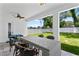 Covered outdoor patio with a wicker table and chairs, perfect for entertaining guests at 4406 W Euclid Ave, Tampa, FL 33629