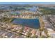 Areal view of community homes and large lake with the red arrow pointing to the subject property at 5236 Clover Mist Dr, Apollo Beach, FL 33572