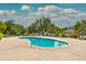 Community pool area with ample seating and surrounding landscaping at 5236 Clover Mist Dr, Apollo Beach, FL 33572