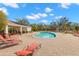 Inviting community pool surrounded by ample seating and a covered lounging area at 5236 Clover Mist Dr, Apollo Beach, FL 33572