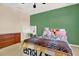 Bright bedroom with modern ceiling fan, desk, and cozy decor, offering a comfortable and inviting space at 7718 Landcare Ln, Tampa, FL 33616