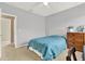 Comfortable bedroom with neutral colors, a ceiling fan, and lots of natural light at 7718 Landcare Ln, Tampa, FL 33616