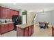 Kitchen featuring granite countertops, stainless steel appliances, island, and eating area at 7718 Landcare Ln, Tampa, FL 33616