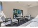 Inviting lanai with comfortable seating, perfect for relaxing and enjoying the outdoors at 7718 Landcare Ln, Tampa, FL 33616