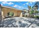 Expansive screened patio perfect for outdoor living, featuring lush landscaping and ample sunlight at 7718 Landcare Ln, Tampa, FL 33616