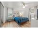 Comfortable bedroom featuring a large bed, bright windows, and a ceiling fan at 1230 7Th Ne Ave, Largo, FL 33770