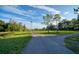 Scenic bike path amidst lush green spaces, perfect for leisurely rides and outdoor recreation under a bright sky at 1230 7Th Ne Ave, Largo, FL 33770