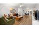 Bright living room featuring hardwood floors, modern furnishings, and an open concept layout at 1230 7Th Ne Ave, Largo, FL 33770