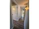 Well-lit hallway offers access to various rooms and a convenient closet space, seamlessly connecting the home at 1501 Howard Pl, Largo, FL 33770