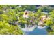 Aerial shot of a waterfront home, highlighting the peaceful surroundings and dock access at 1802 E Park Cir, Tampa, FL 33610