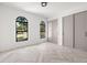 Spacious bedroom with windows and sliding closet doors at 1802 E Park Cir, Tampa, FL 33610